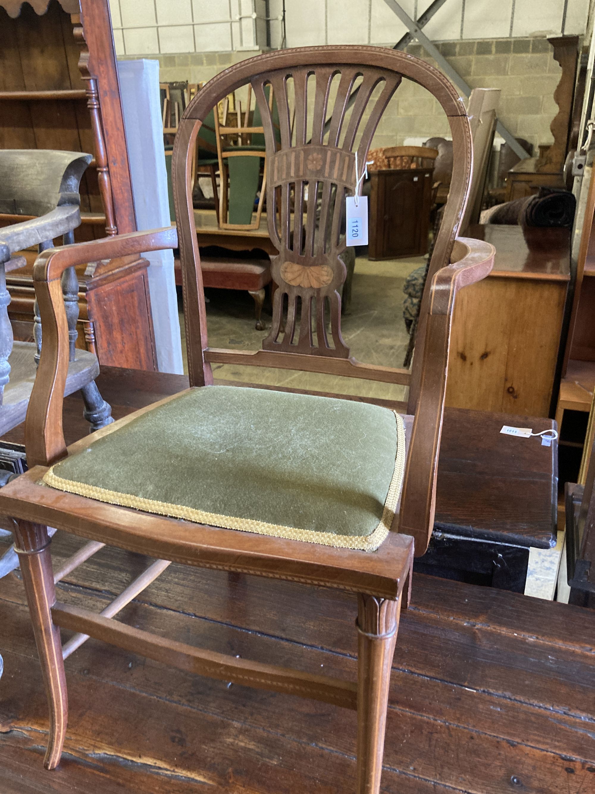 A Victorian bleached elm and ash smokers bow chair and an Edwardian inlaid mahogany elbow chair (2)